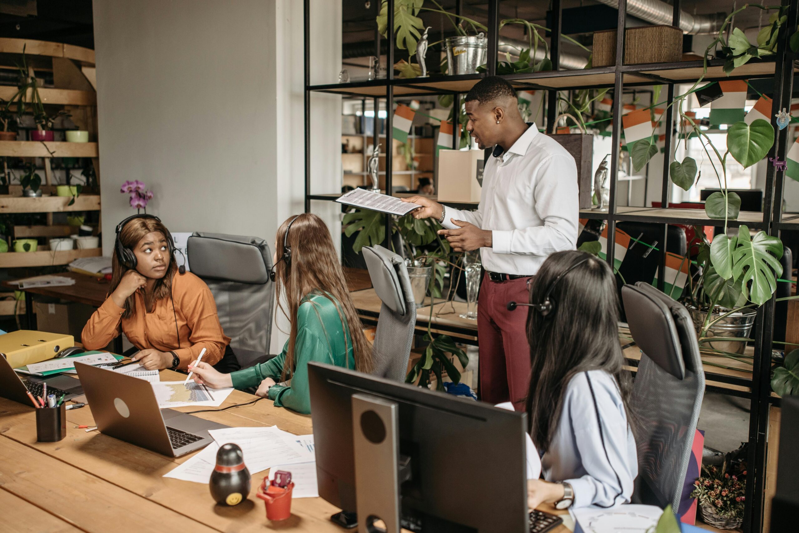 About Diverse group of call center agents collaborating in a modern office space.